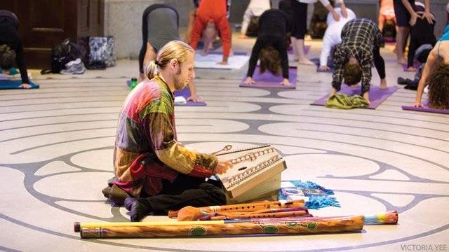 Kirtan man playing for yoga class